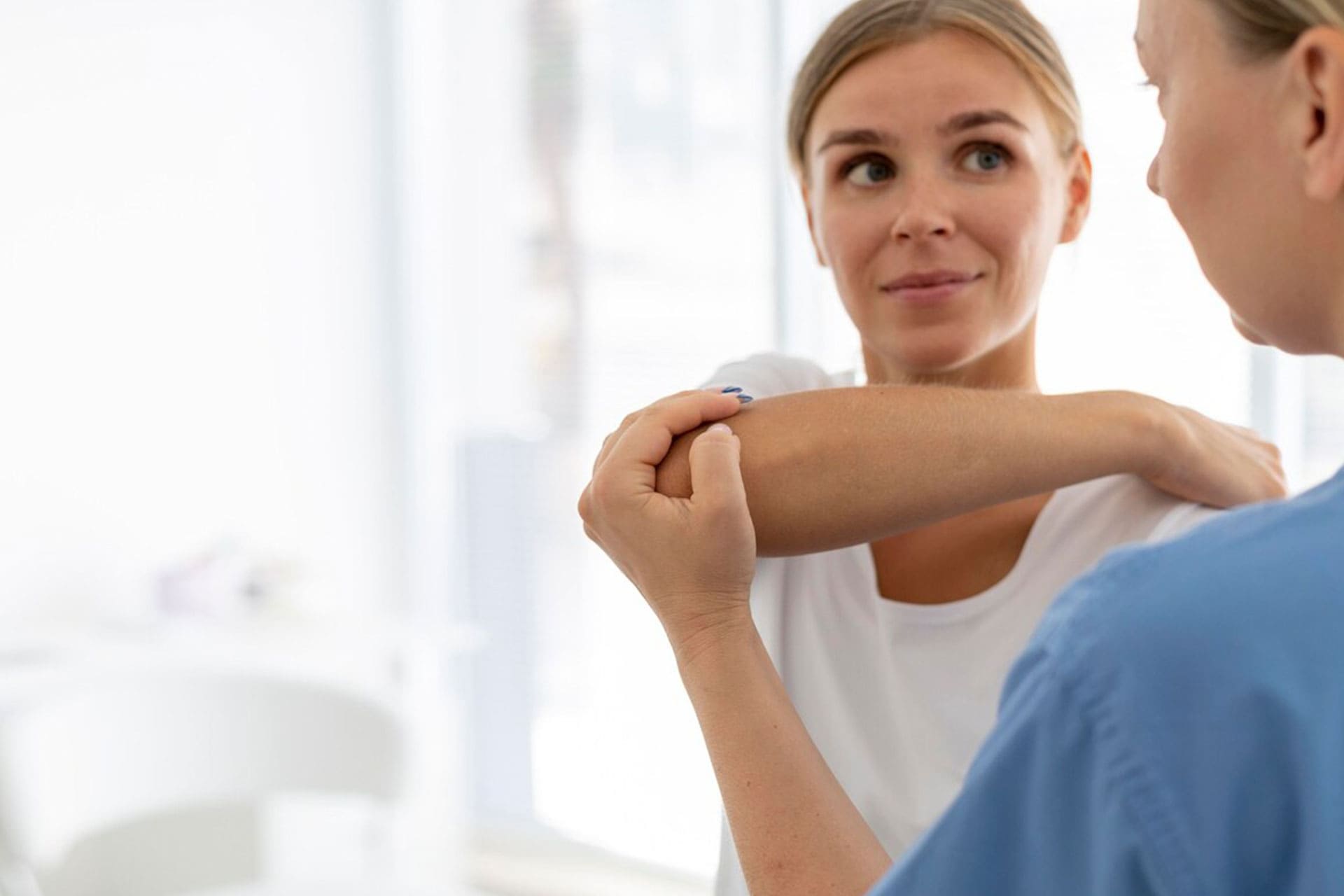 physiotherapist-helping-young-female-patient-her-clinic_23-2149115568-CUT